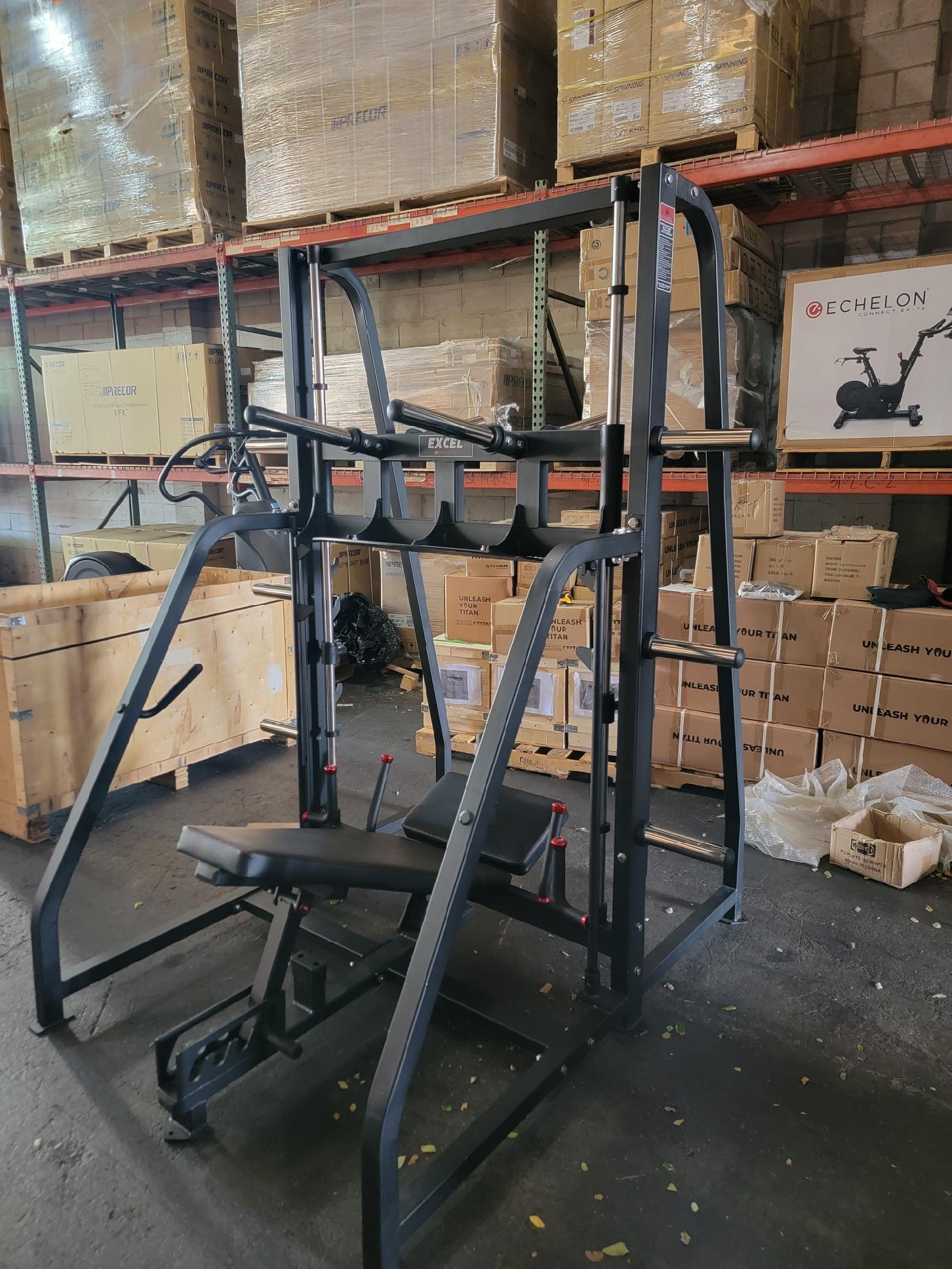 Vertical leg outlet press smith machine